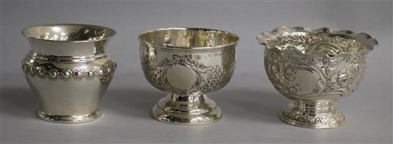 A late Victorian repousse silver pedestal bowl and two Edwardian repousse silver bowls, 7 oz.